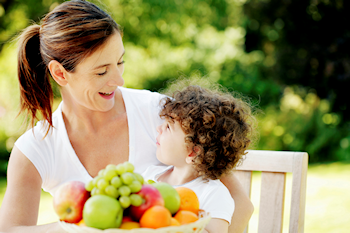 woman and child with healthy food