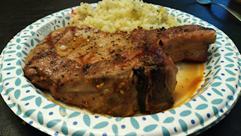 Pork chop and side dish on plate